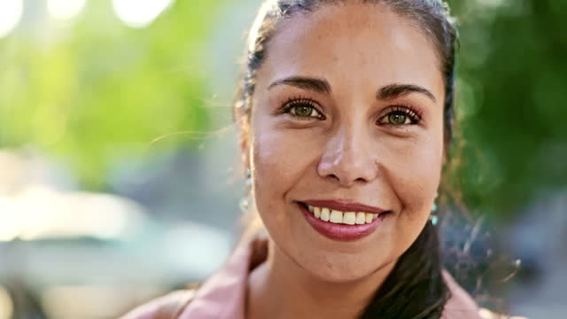 Headshot of mid adult woman outdoors in springtime