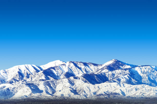 Heavy snow on Southern California's San Gabriel Mountains as seen from the Mojave Desert stock photo