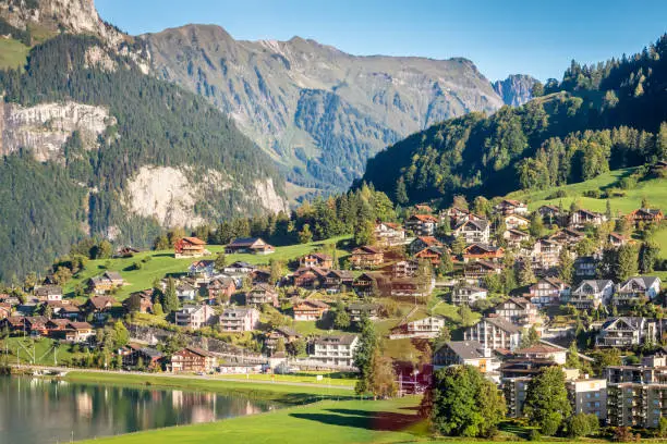 Alpine Engelberg village from above in swiss alps at dramatic sunset,  Obwalden canton, Switzerland