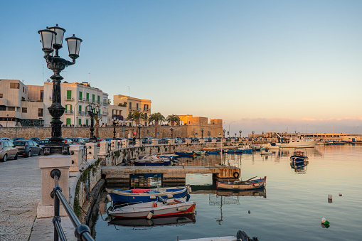 Panoramic view of the seafront and port of Bari at sunset. Puglia, Italy.