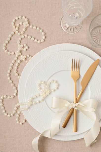 istock Festive wedding, birthday table setting with golden cutlery 1475570518