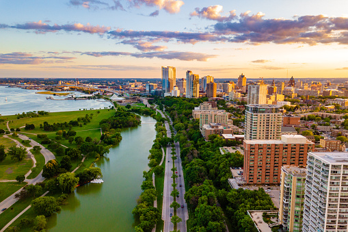 Downtown Austin skyline at sunset elevated view with Colorado river. The view includes several modern office and apartment towers.