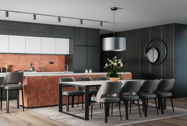 istock Modern minimalist kitchen with long island with stools. Oak wood and stone. Orange backsplash color. 1475572545