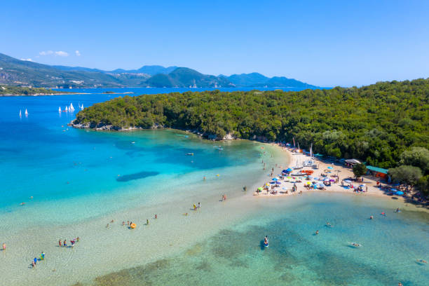 Aerial view of iconic paradise sandy beaches with turquoise sea in complex islands of Agios Nikolaos and Mourtos in Sivota area, Epirus, Greece Aerial view of iconic paradise sandy beaches with turquoise sea in complex islands of Agios Nikolaos and Mourtos in Sivota area, Epirus, Greece parga greece stock pictures, royalty-free photos & images