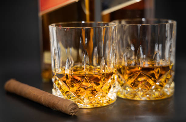 istock Two glasses of whiskey and a cigar 1475577313