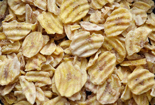 Closeup of lightly salted banana chips.