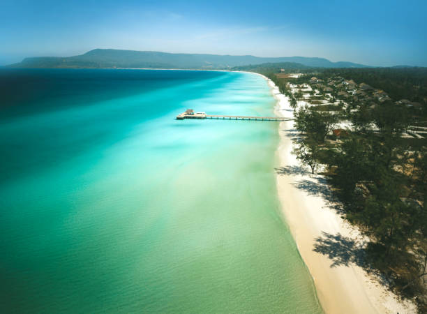 istock Long deserted beach with white sand and clear water 1475587500