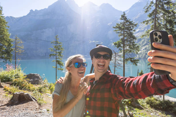 istock Two people take selfie while hiking around beautiful alpine lake 1475588809