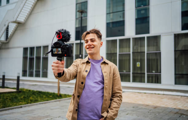 istock Young man recording vlog in the city 1475590181