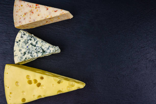 istock Various types of cheese on a slate board. Top view 1475590484