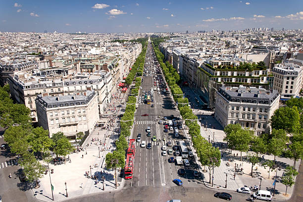 View on Paris from Arc de Triomphe on sunny day. Avenue Champs elysees in front.