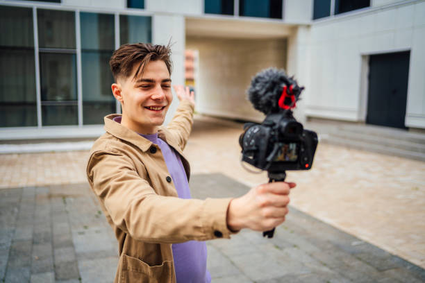istock Young man recording vlog in the city 1475592068