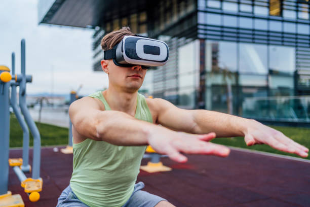 istock Sporty man exercising with virtual reality headset 1475592283