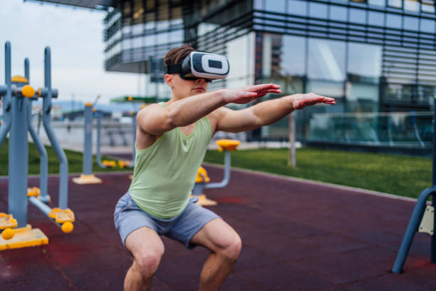 istock Sporty man exercising with virtual reality headset 1475593112