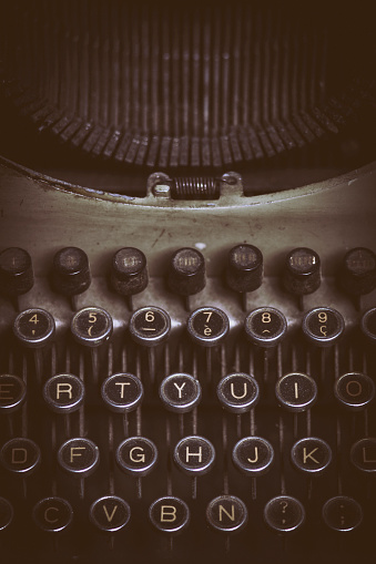 The words 'Once Upon A Time...' picked out on a grungy old typewriter. Macro image with limited depth of field focussed on 'on' in 'upon'.