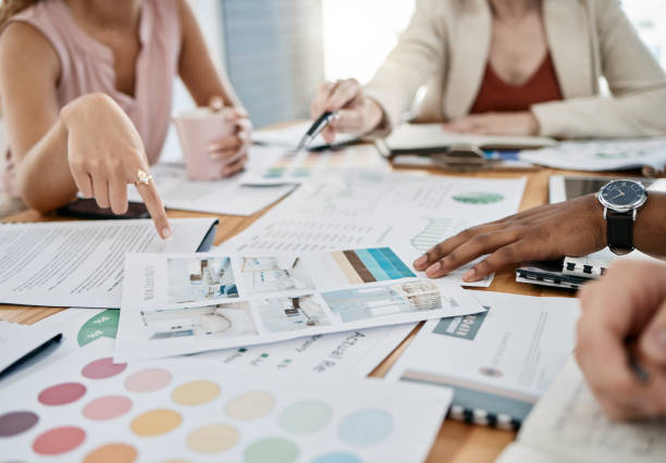 Hands, accounting and documents with a business team planning in collaboration for growth in an office. Finance, data and teamwork with a man and woman employee group working on a financial budget