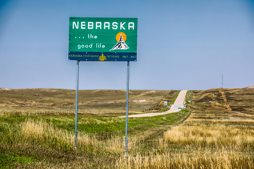 Nebraska welcome sign at the Colorado state line welcoming drivers to the state of Nebraska as they drive south on State Highway 71.