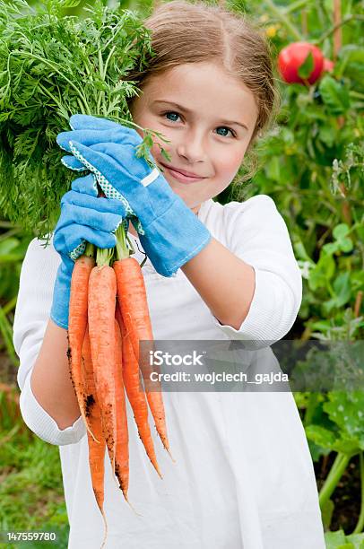 Lovely Little Girl Showing Off Her Gardening Skills Stock Photo - Download Image Now