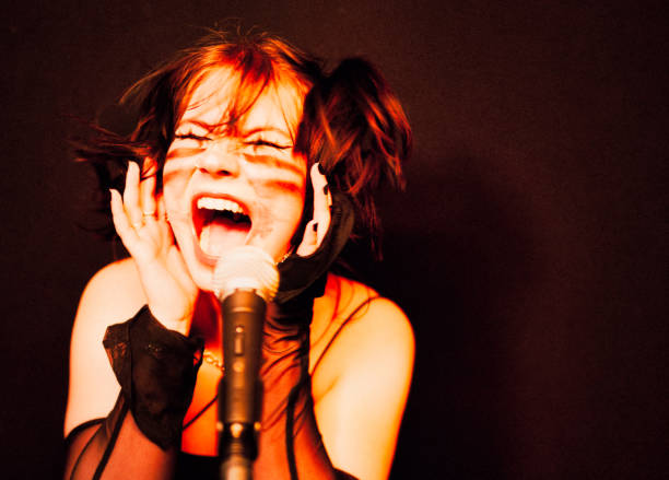 istock The female rock singer. 1475598228