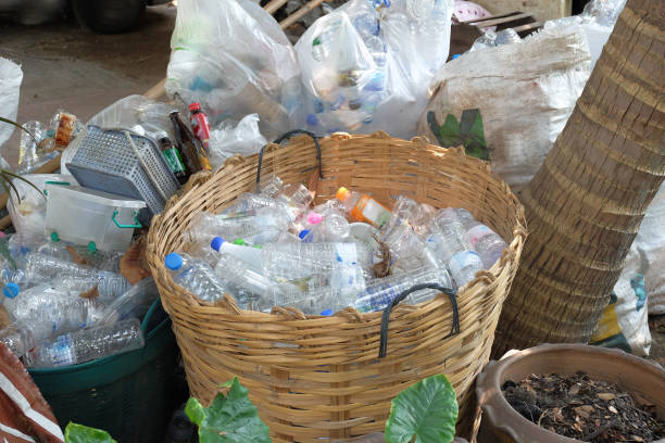 istock Reuse or recycling bottle in garbage, environment concept. 1475602273