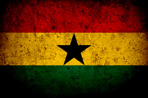 Flag of Ghana with faded grunge effect and vignette, perfect for backgrounds and design.