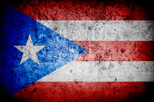 Flag of Puero Rico with faded grunge effect and vignette, perfect for backgrounds and design.