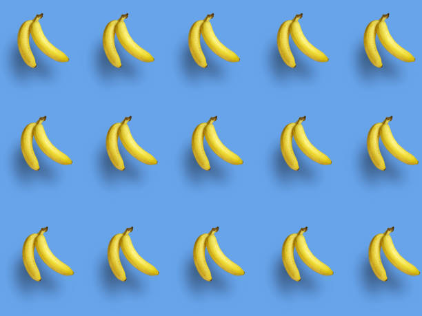 istock pattern of two bananas on a blue background 1475604278