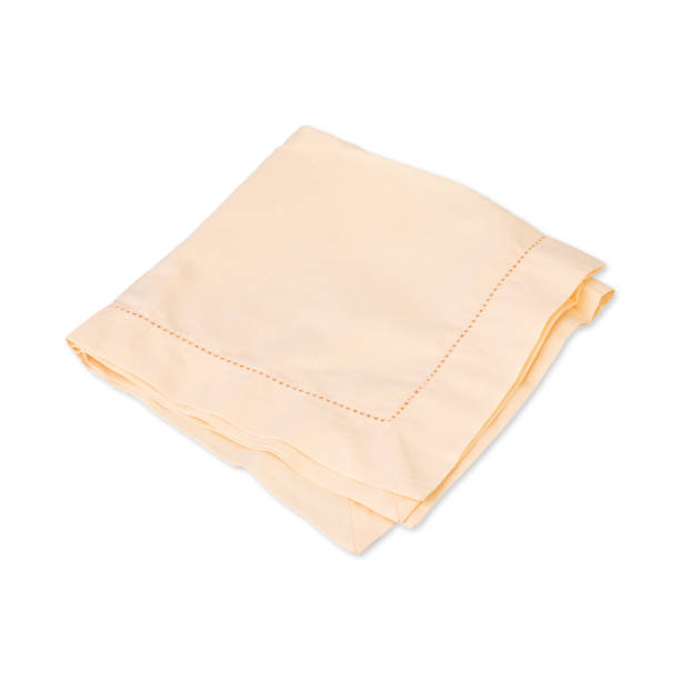 istock Folded salmon color tissue napkin isolated over white background 1475606616