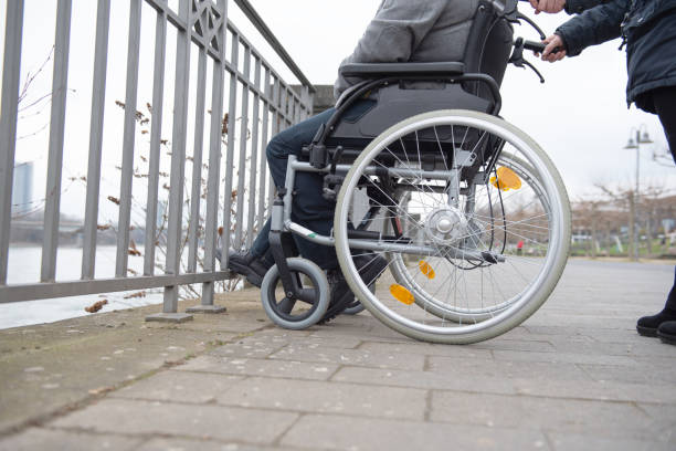 istock a physically disabled person on a wheelchair at a walk 1475610111