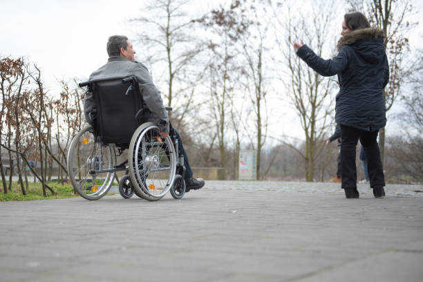istock a physically disabled person on a wheelchair at a walk 1475610251