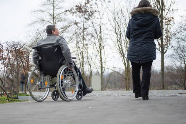istock a physically disabled person on a wheelchair at a walk 1475610333