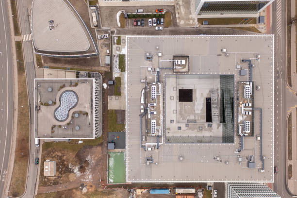 istock Drone photography of office rooftops during cloudy spring day 1475617083