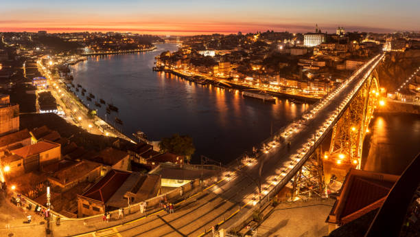Panoramic view, at dusk, over the Douro river and the city of Porto from the Serra do Pilar viewpoint in Vila Nova de Gaia, Portugal. stock photo