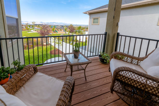 istock Small balcony with potted plants and woven chairs with table 1475617870