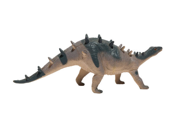 istock A worn out dinosaur toy with spikes on its back isolated on white background. kentrosaurus. 1475619165