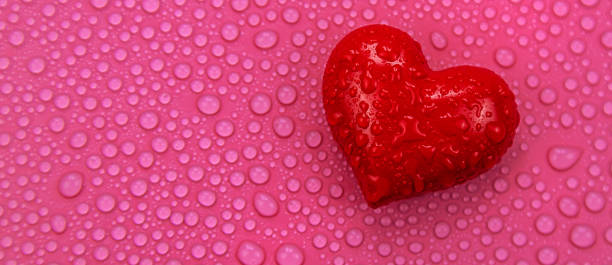 istock Wet heart background valentine. Selective focus. Red. 1475622075