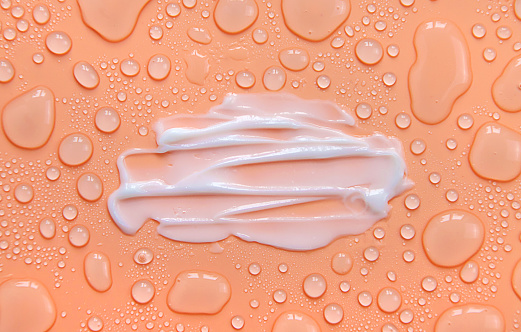 Moisturizing cream for face and body wet background. Selective focus. Wet.