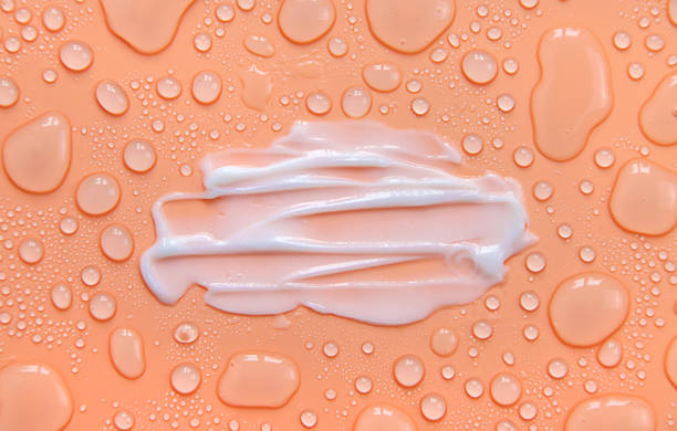 moisturizing cream for face and body wet background. selective focus. - hayvan vücudu stok fotoğraflar ve resimler