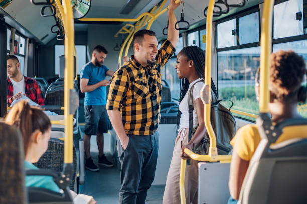 istock Multiracial friends talking while riding a bus in the city 1475622214
