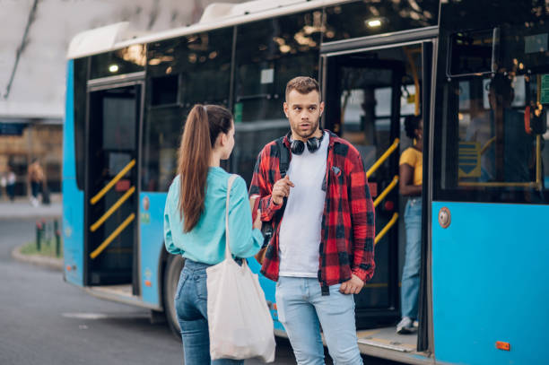 istock Friends waiting public transportation on a bus stop 1475622253