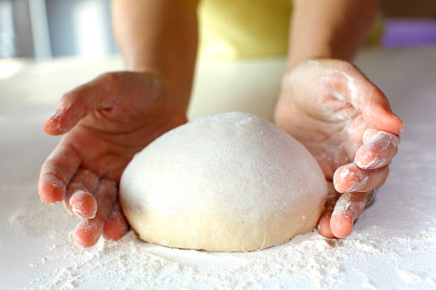 Bread making and kneading stock photo