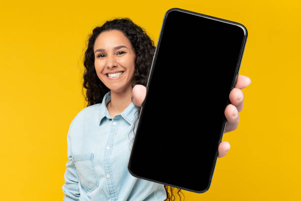 istock Excited lady holding empty smart phone screen in hand 1475624127