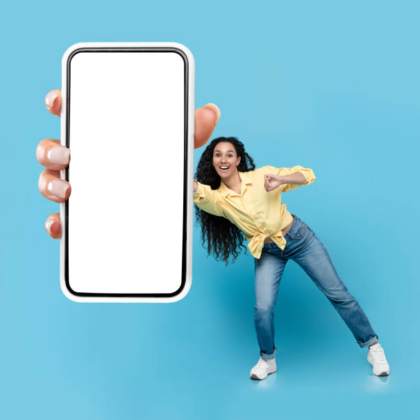 istock Arabic Lady Showing Smartphone Empty Screen Advertising Application, Blue Background 1475624220
