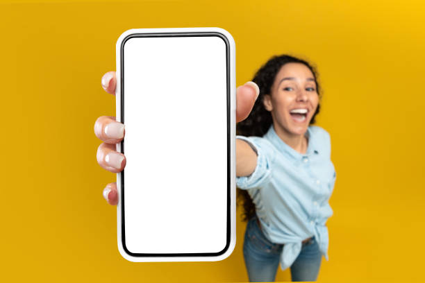 istock Woman showing white empty smartphone screen close to camera 1475624719