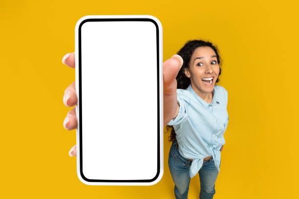 istock Excited oman showing white empty smartphone screen close to camera 1475624723