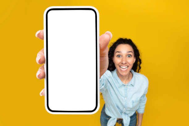 istock Woman showing white empty smartphone screen close to camera 1475624734