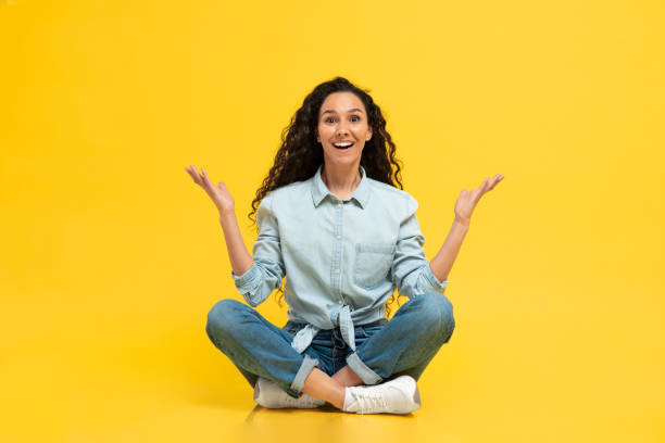 istock Middle Eastern Lady Smiling To Camera Sitting Over Yellow Background 1475625054