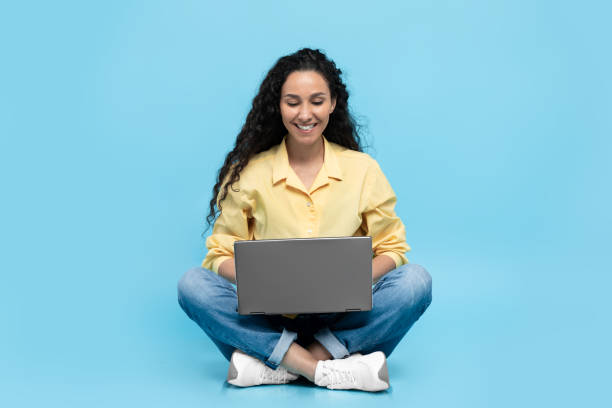 istock Arabic Lady Working Online On Laptop Sitting Over Blue Background 1475625065