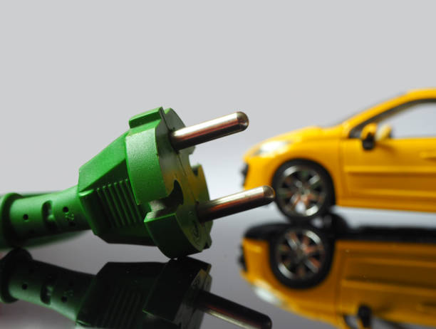 istock Electric vehicle charging by green power 1475625411