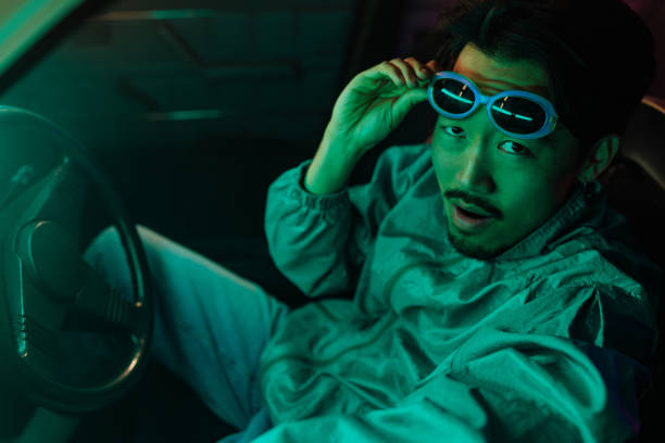 istock Stylish Asian man in car. 1475629011